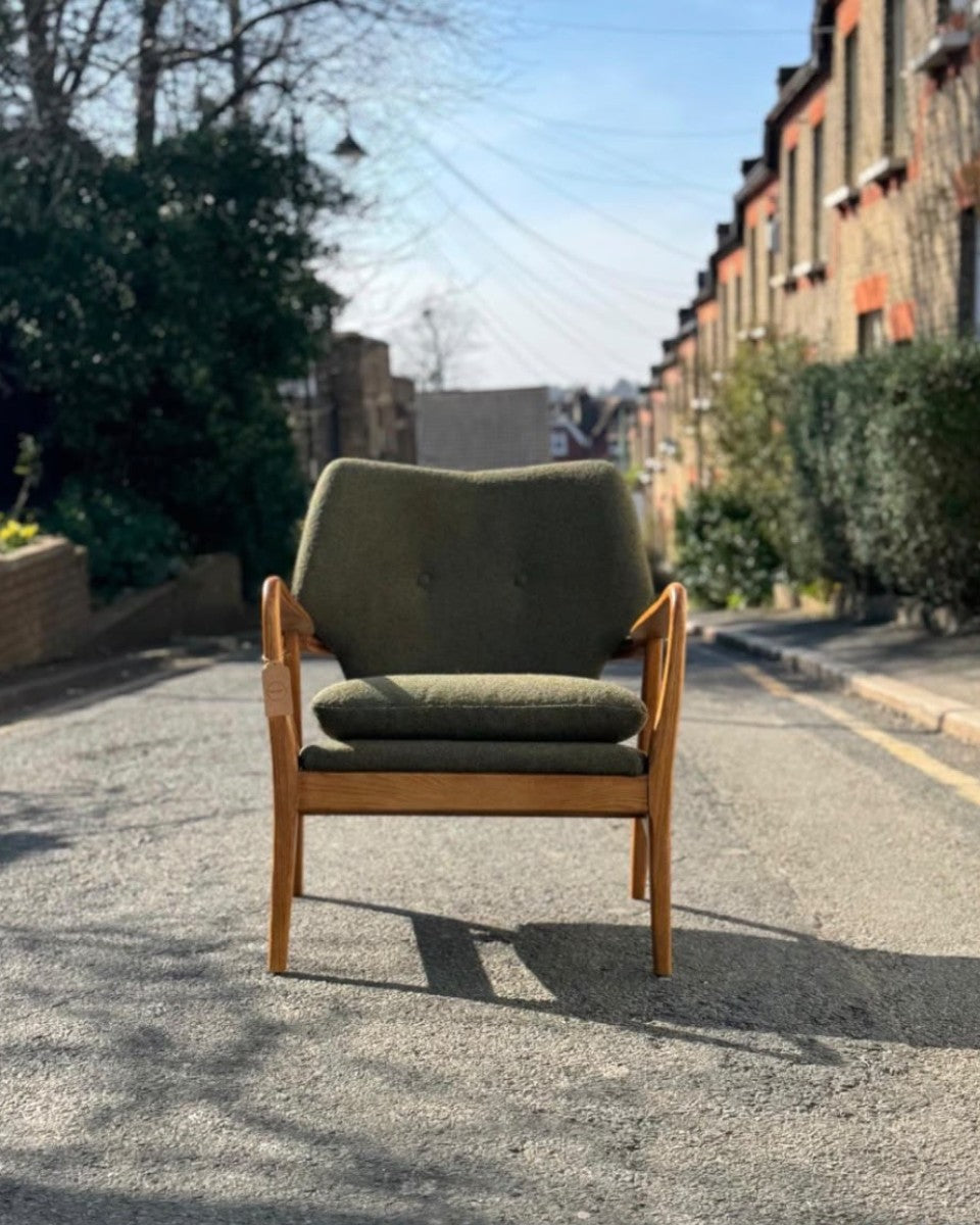 A green armchair on a Crystal Palace street